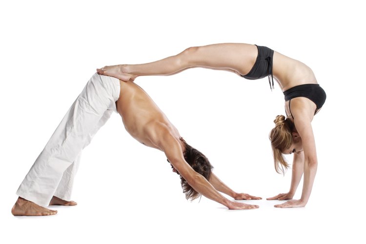 Couple yoga head stand pose - Stock Image - Everypixel